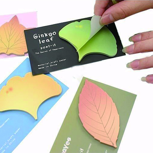 Hanging paper tags with string attachment and printed design, white background